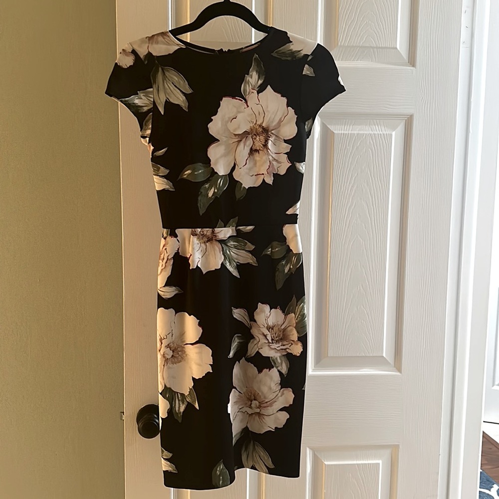 Love…ady black floral dress. X Small. 95% Polyester 5% Spandex.
